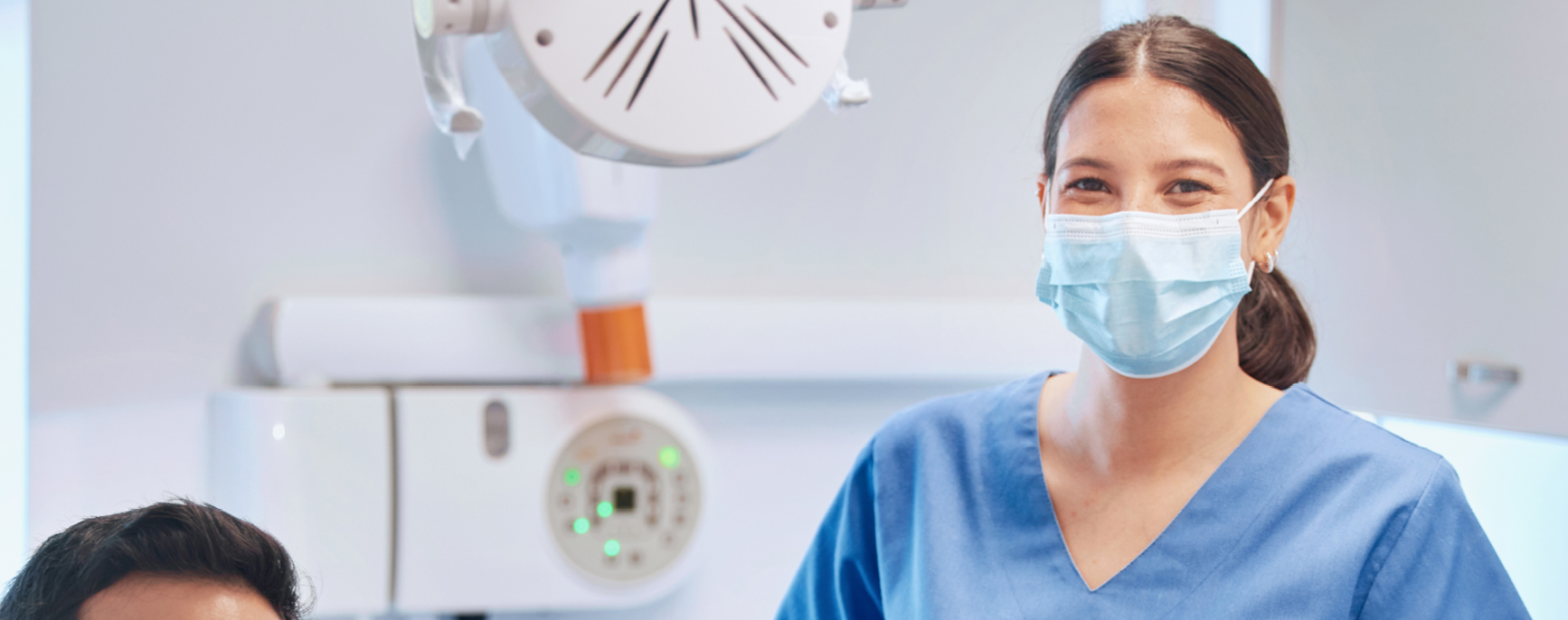 Photo of dentist and patient smiling